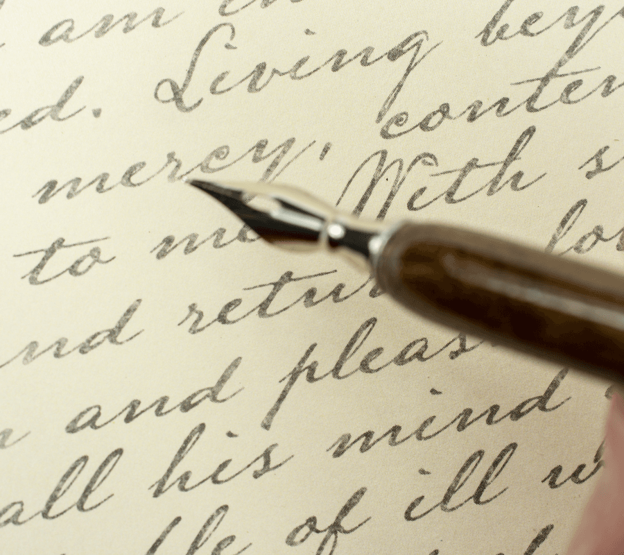 A vintage fountain pen hovers over elegantly cursive handwritten text on aged paper.