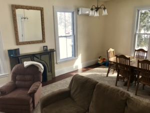 Photo of the Roosevelt Suite room with couch and table